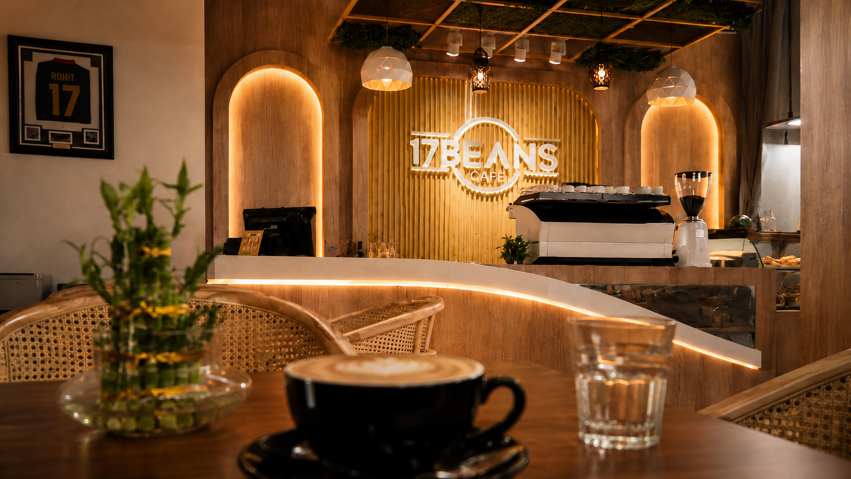 Warm interior of 17 Beans Cafe, looking across a coffee table toward the bar